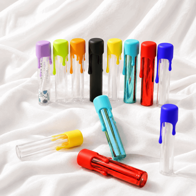 Custom dripping wax child-resistant glass pre-roll tubes in multiple cap colors
